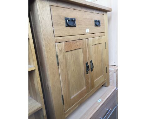 A modern light oak side cabinet. 