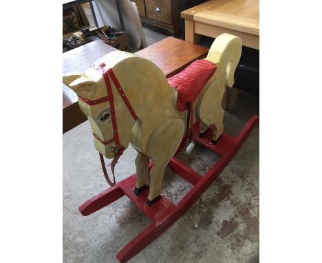 A painted wooden rocking horse. 