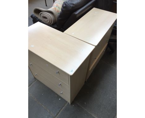 A pair of light wood effect chests of drawers. 