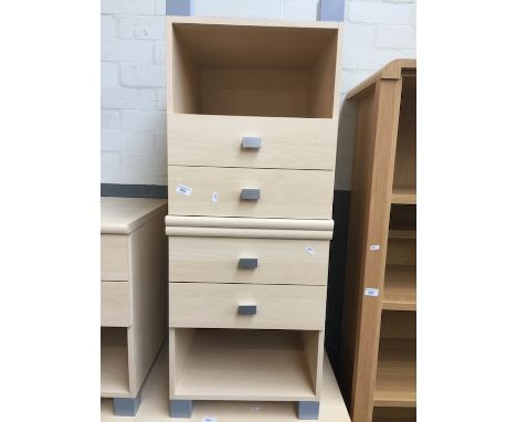 A pair of modern light wood effect bedside cabinets. 