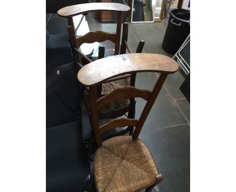 Three rush seated oak ladder back chairs. 