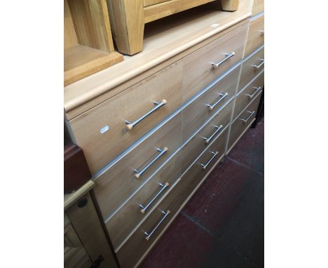 A light wood effect chest of drawers by Alstons Furniture. 