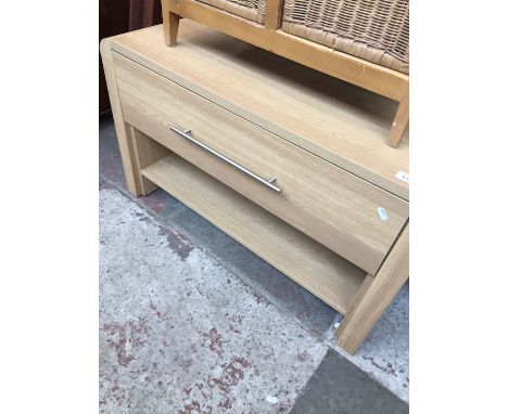 A light oak effect AV stand. 