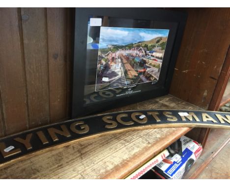 A replica "Flying Scotsman" engine sign and a photograph 