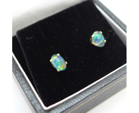 A pair of 9ct gold, opal doublet stud earrings