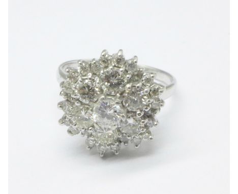 A white metal set diamond cluster ring, 7g, T