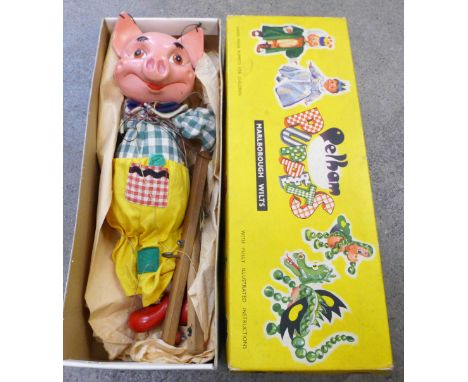 A Pelham puppet, pig, boxed