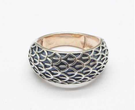 A silver gilt, dragon scale design ring, O