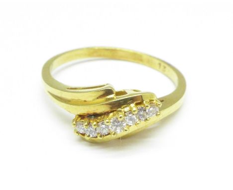 A yellow metal, seven stone diamond ring, 3g, N