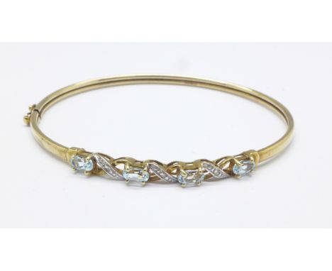 A 9ct gold, aquamarine and diamond bangle, 4.4g