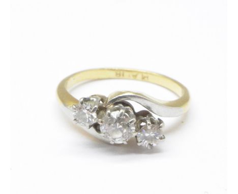 An 18ct gold, platinum set three stone diamond ring, 2.8g, H