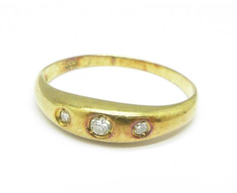 A 14ct gold, three stone diamond ring, 1.2g, K