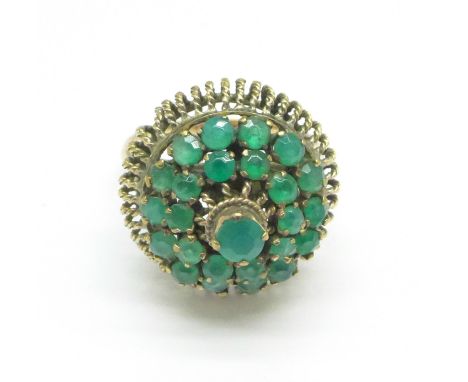 A yellow metal and green stone cluster ring, 4.8g, N