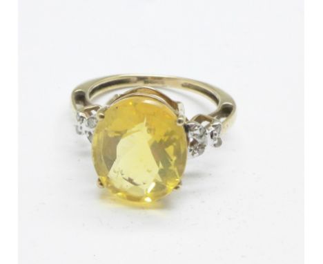 A 9ct gold and yellow beryl ring with diamond shoulders, 2.4g, K