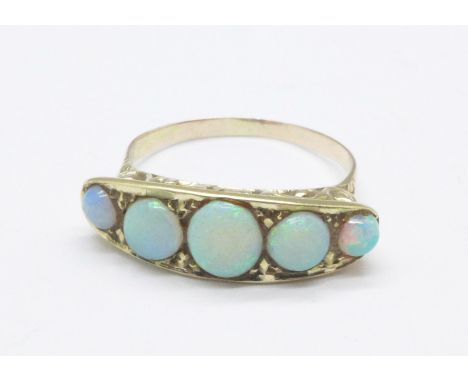 A yellow metal and five stone opal ring, 3.4g, Q
