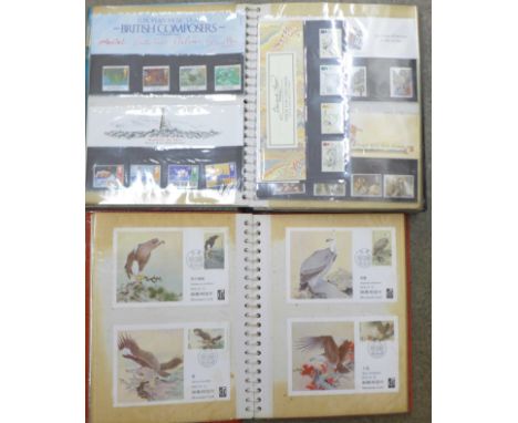 An album of Chinese first day covers and pre-stamped postcards and an album of Royal Mail mint stamps