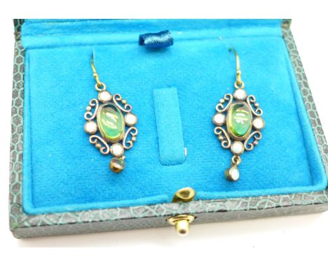 A pair of peridot and opal drop earrings with yellow metal hooks