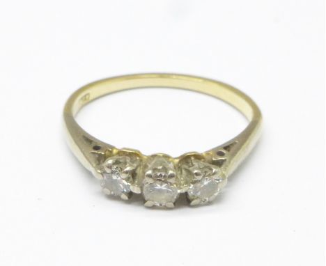 An 18ct gold, three stone diamond ring, 2.5g, N