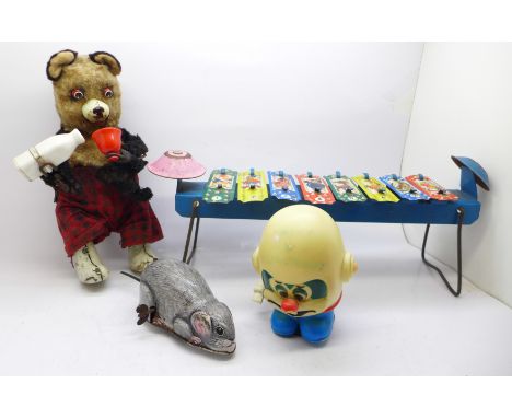 A Marx wind up toy, a clockwork drinking Teddy bear, a Japanese clockwork mouse and a tin plate xylophone