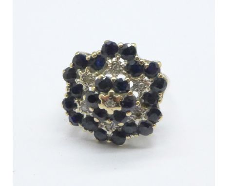 A 9ct gold, sapphire and diamond cluster ring, 4.8g, R