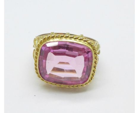 A yellow metal and pink stone ring, marked 585, 8g, T