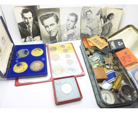 A box of assorted items including thimbles, compass, trench art lighter, a medal, coins, etc.