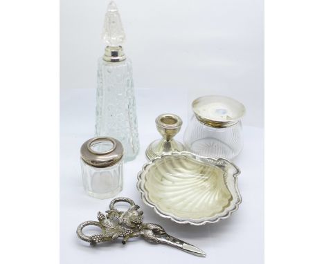 Silver scissors, a silver candlestick and a plated and glass butter dish