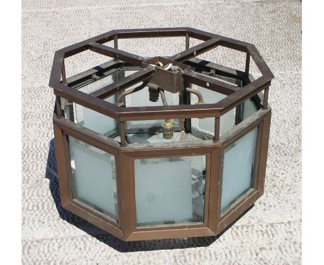 A painted metal and frosted glass ceiling light of octagonal form, 51cm (20ins) wide. 