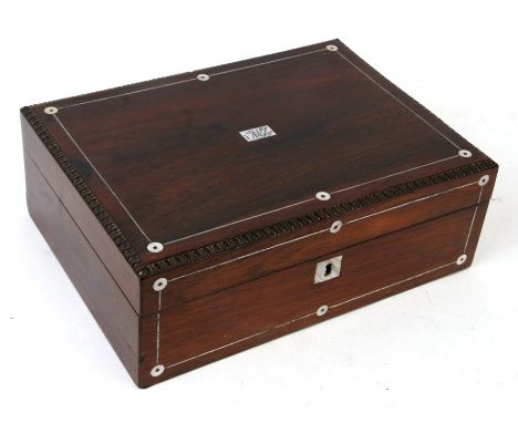 A 19th century rosewood sewing box with pewter and mother of pearl inlay, 30cms (12ins) wide.