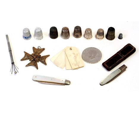 Two silver bladed mother of pearl fruit knives; together with a group of thimbles to include silver examples; and a bone aide