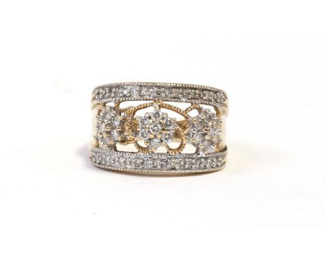 A 9ct gold ring set with diamond floral clusters, approx UK size K, weight 3.7g.