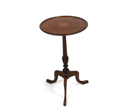 An inlaid mahogany wine table on turned column and tripod base.