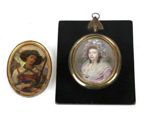 A Georgian portrait miniature of a lady wearing a portrait miniature pendant around her neck; together with a portrait miniat