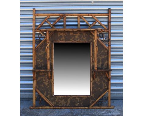 A bamboo mirrored wall shelf, 73cm (28.75ins) wide.