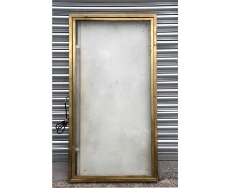 A large brass framed light box, possibly a restaurant front menu display, 145cm (57ins) wide.