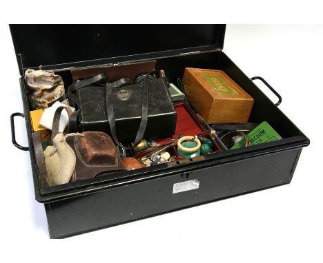 A tin deed box containing miscellaneous items to include costume jewellery, binoculars, chess set and other items.