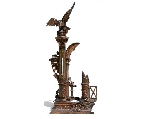 A late 19th century bronzed spelter desk top thermometer surmounted with an eagle, 47cm (18.5ins) high 