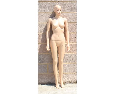 A life size standing female mannequin. 