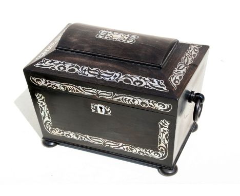 An early 19th century coromandel sarcophagus two-division tea caddy with mother of pearl inlay, on compressed bun feet, 23cms