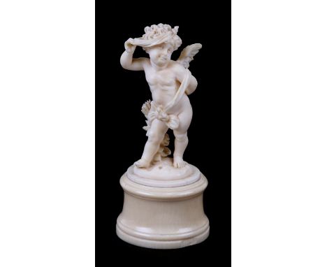 A 19th century finely carved ivory figure of cupid, 11cm (4.25ins) high Condition ReportSmall loss to the tip of one wing and