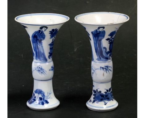 A pair of Chinese blue &amp; white Kangxi gu vases, decorated with figures and flowers, blue leaf Artemisia leaf mark to the 
