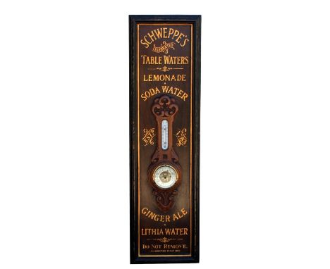 A Victorian oak barometer thermometer mounted on a board with gilt lettering "Schweppes Table Waters, Lemonade and Soda Water