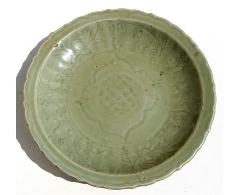 A Chinese Longquan celadon glazed charger with incised foliate scroll decoration, 36.8cms (14.5ins) diameter.Condition Report