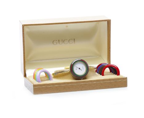 LADY'S GUCCI BANGLE QUARTZ WRIST WATCHoriginally purchased 1989, the round white dial lacking numerals, with interchangeable 