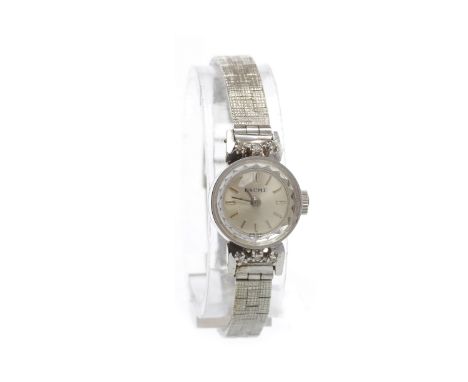 LADY'S BAUME NINE CARAT WHITE GOLD MANUAL WIND COCKTAIL WATCHc.1970, the round white dial with applied baton hour markers, th