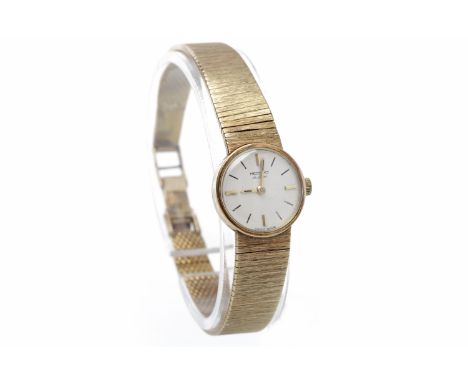 LADY'S RECORD NINE CARAT GOLD MANUAL WIND WRIST WATCHsigned 17 jewel movement, the round white dial with applied baton hour m