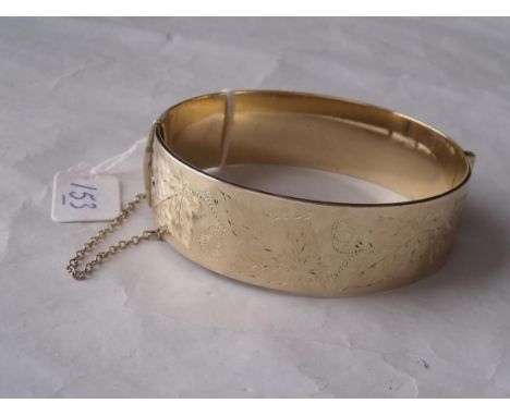 A heavy rolled gold bangle       