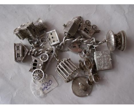 A good quality vintage silver charm bracelet  with large silver charms several opening 160g   