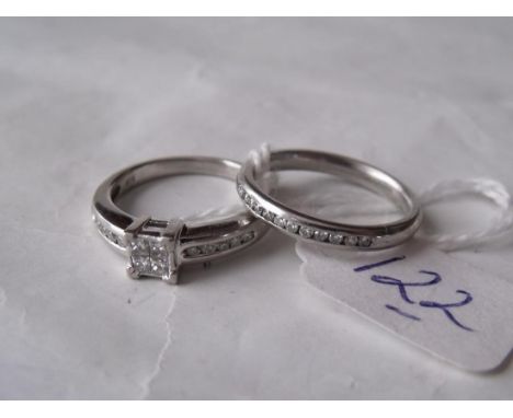 A GOOD PLATINUM & DIAMOND  cluster ring with diamond mounted shoulders  also a platinum diamond set eternity ring  both size 