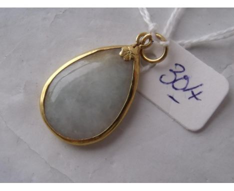 A high carat gold mounted pear shaped jade   pendant 3.4g inc       